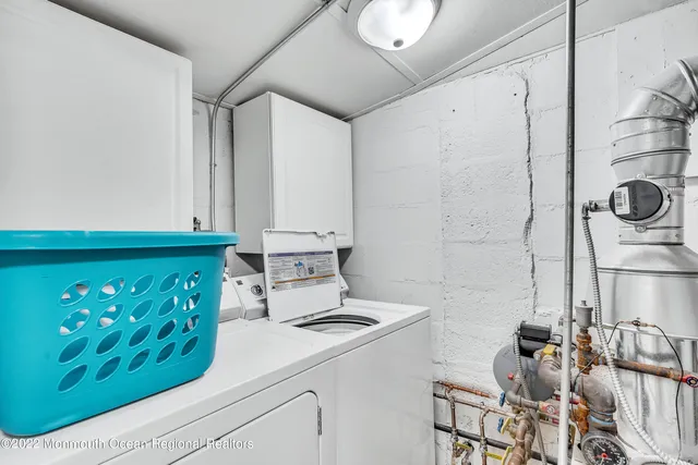 a kitchen with a refrigerator and a stove