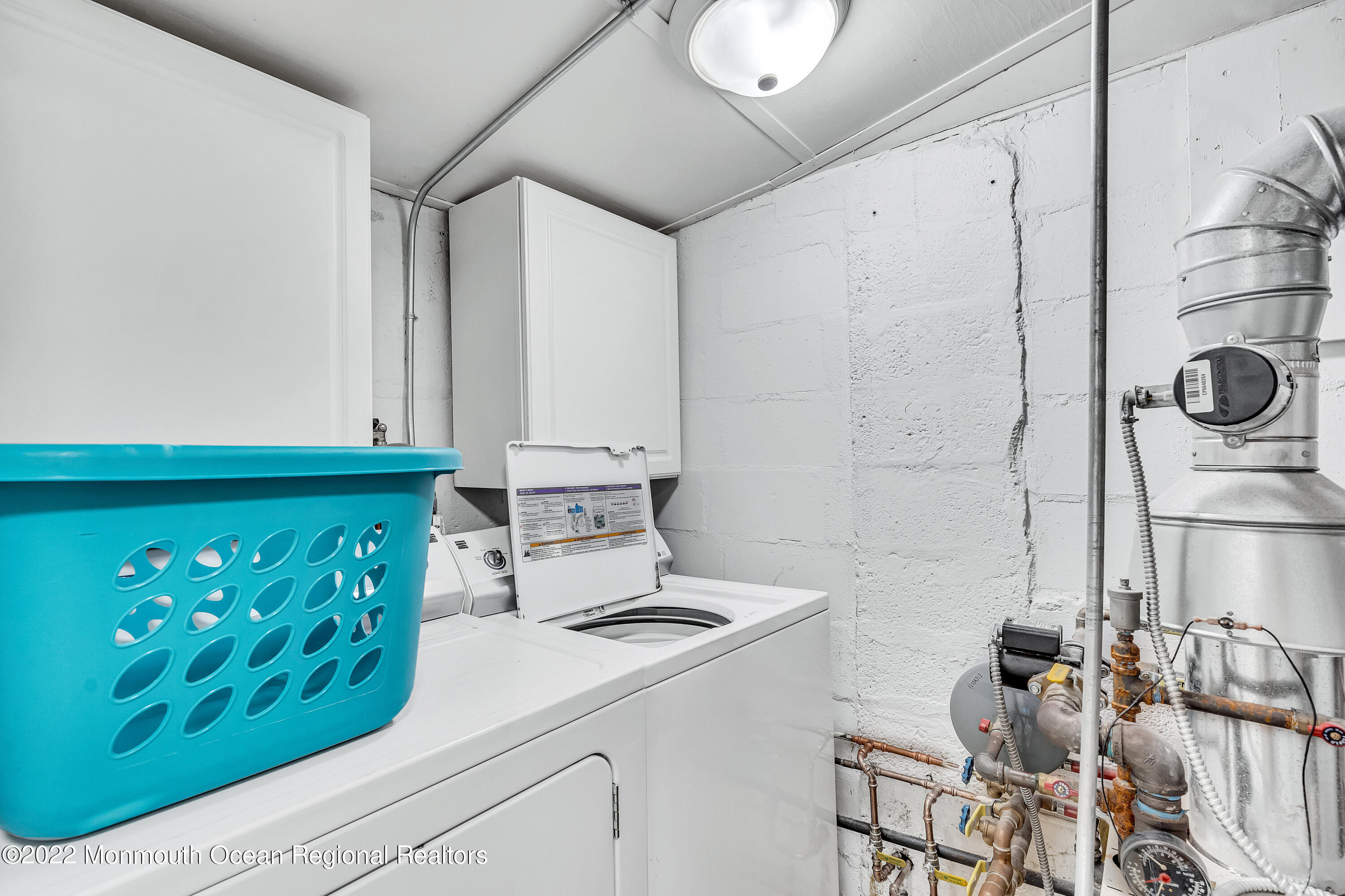 57 Fielder Avenue Seaside Heights, NJ 08751 - Photo 18 of 31 a kitchen with a refrigerator and a stove