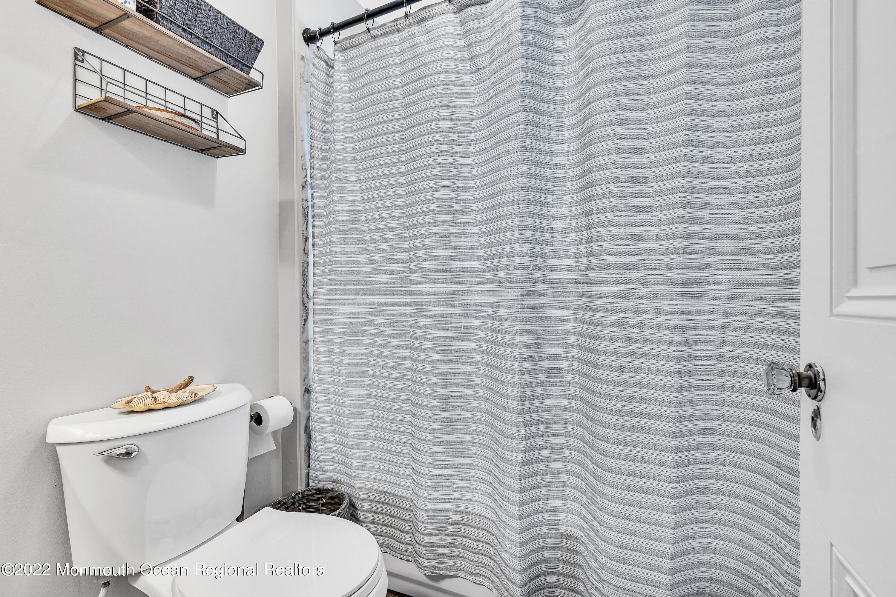 57 Fielder Avenue Seaside Heights, NJ 08751 - Photo 22 of 31 a white toilet sitting next to a white wall