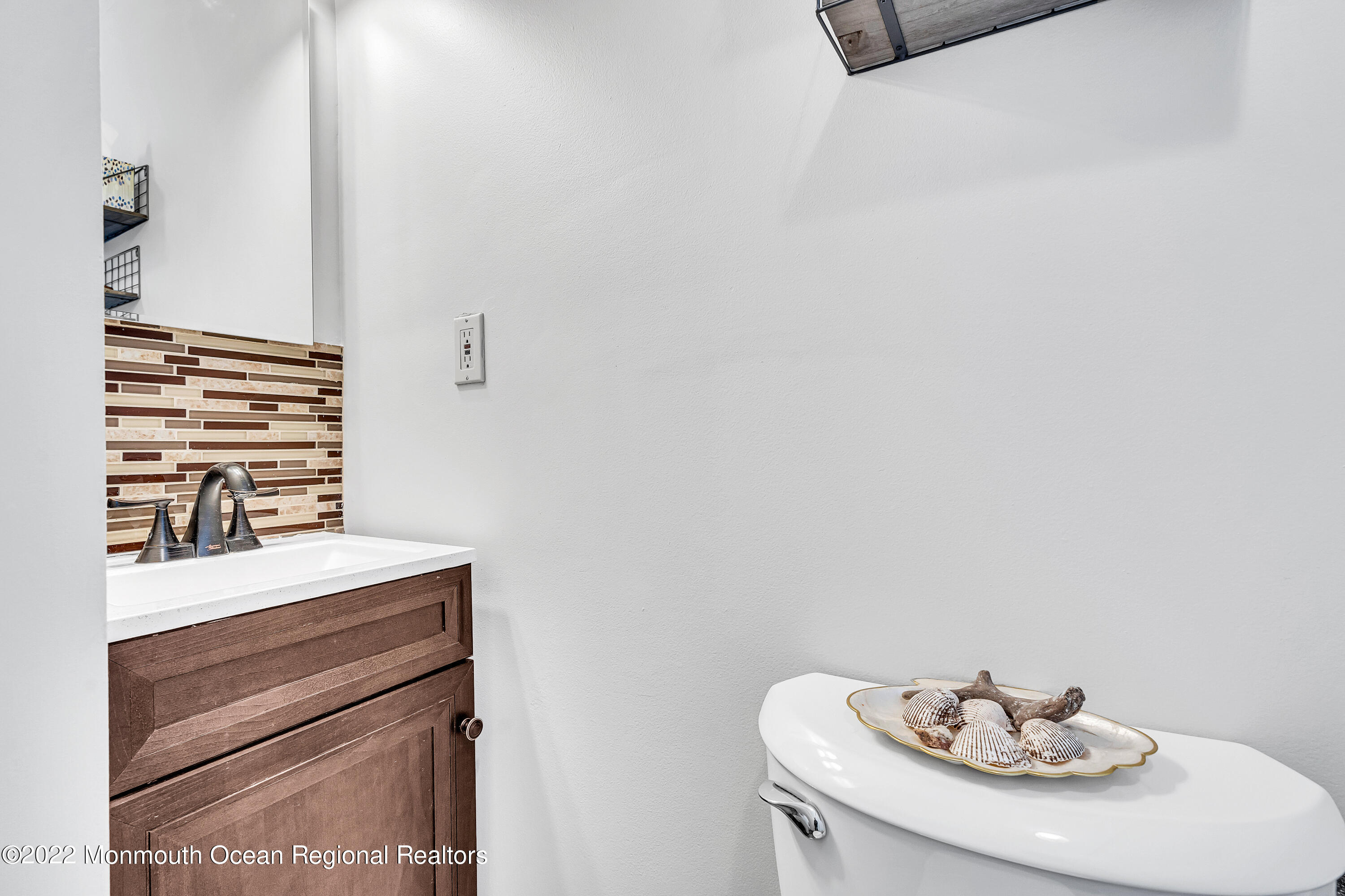57 Fielder Avenue Seaside Heights, NJ 08751 - Photo 23 of 31 a bathroom with a sink and a mirror
