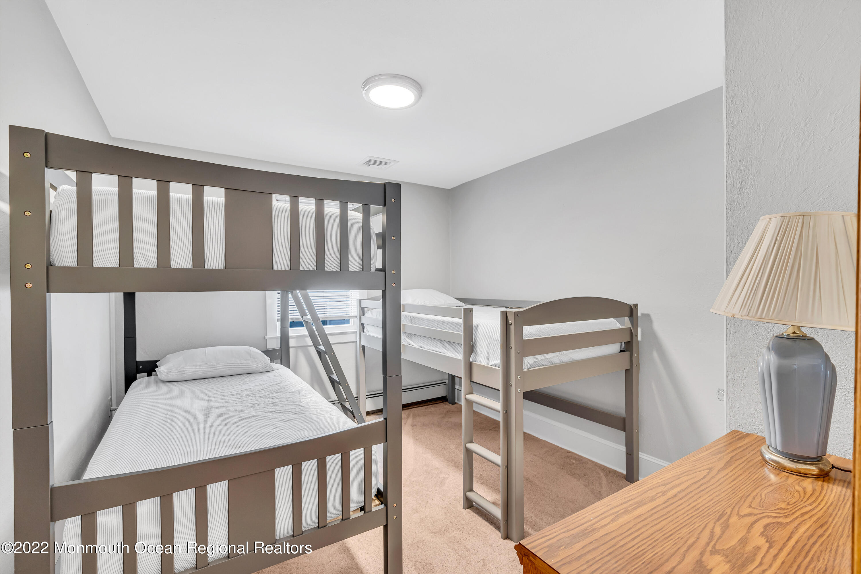 57 Fielder Avenue Seaside Heights, NJ 08751 - Photo 25 of 31 a bedroom with furniture and a window