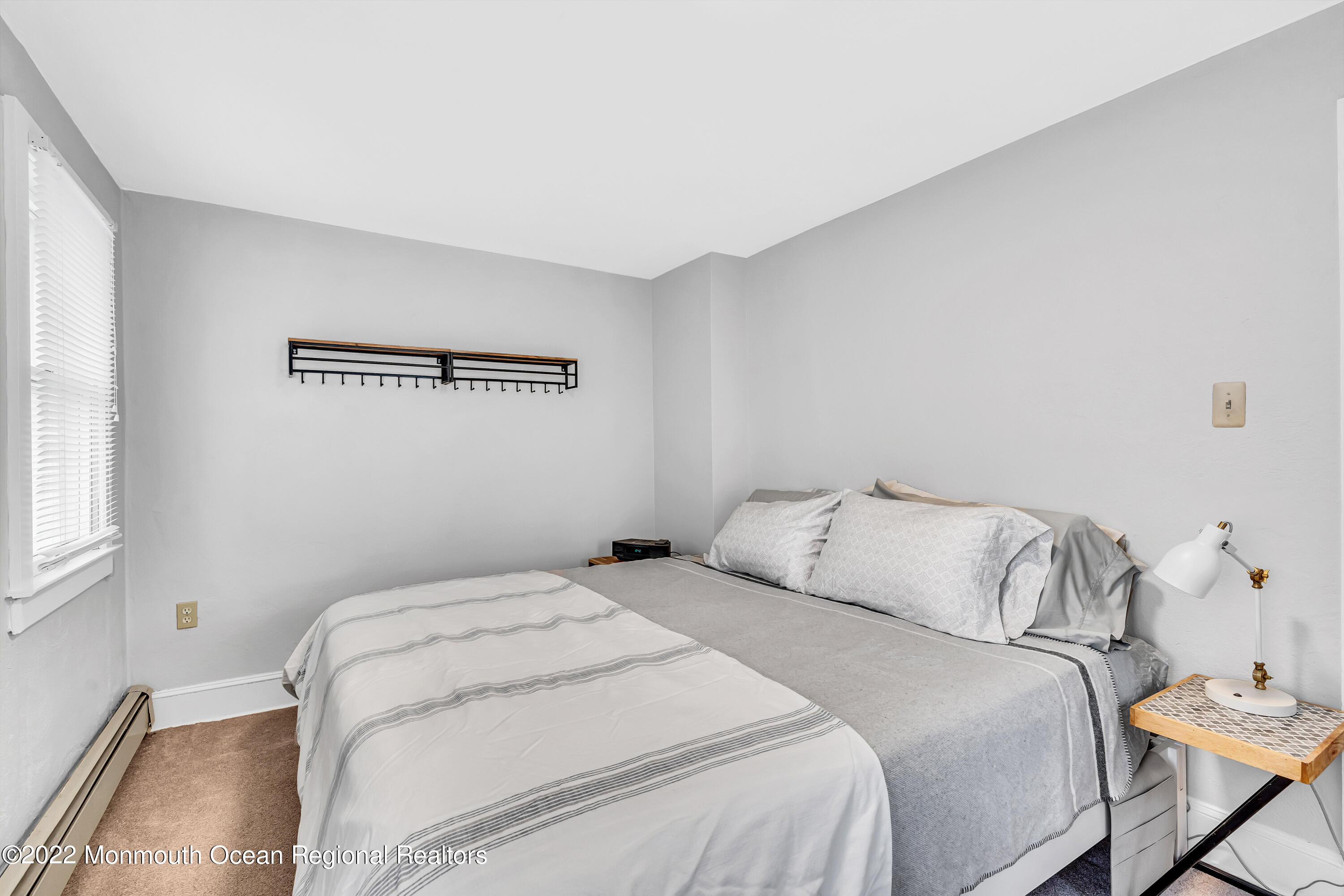 57 Fielder Avenue Seaside Heights, NJ 08751 - Photo 27 of 31 a bedroom with a bed and a window