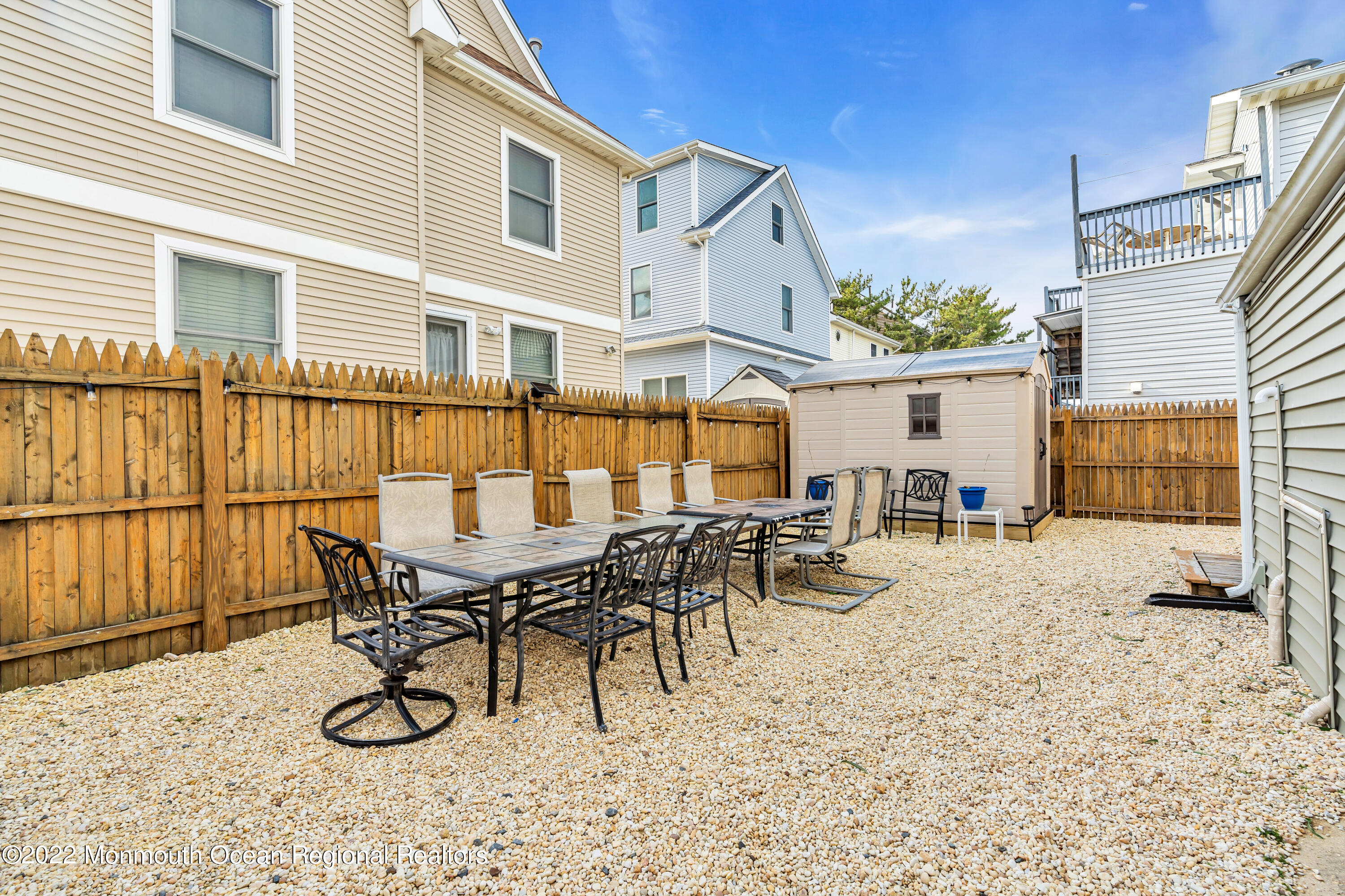 57 Fielder Avenue Seaside Heights, NJ 08751 - Photo 30 of 31 a view of a dinning table and chairs in the patio