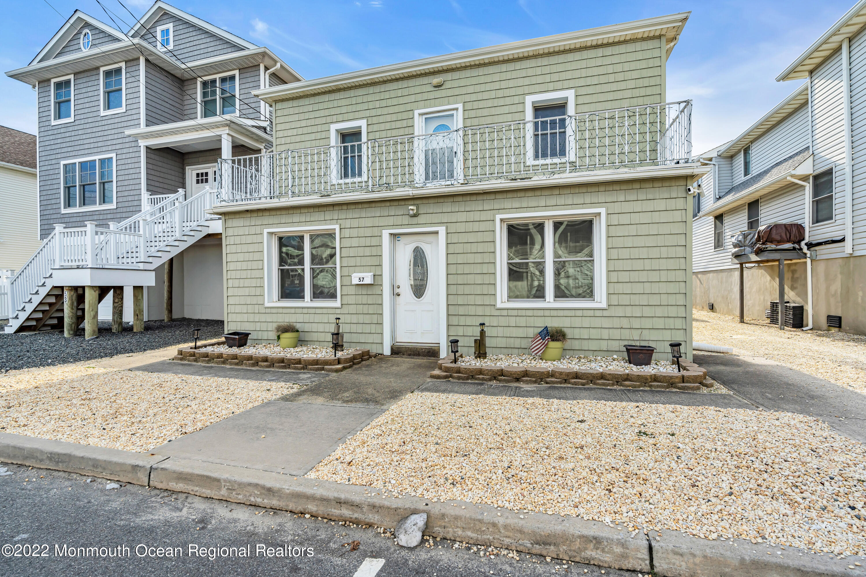 57 Fielder Avenue Seaside Heights, NJ 08751 - Photo 8 of 31 a front view of a house with a yard