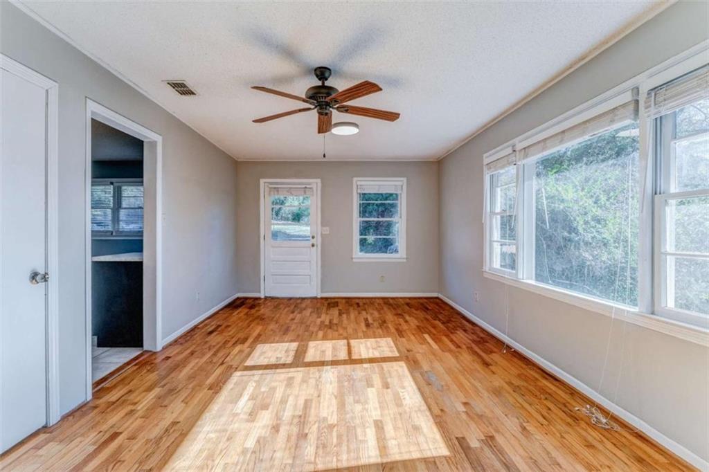 1407 East 2nd Avenue Southeast Rome, GA 30161 - Photo 17 of 28 a view of empty room with wooden floor and fan