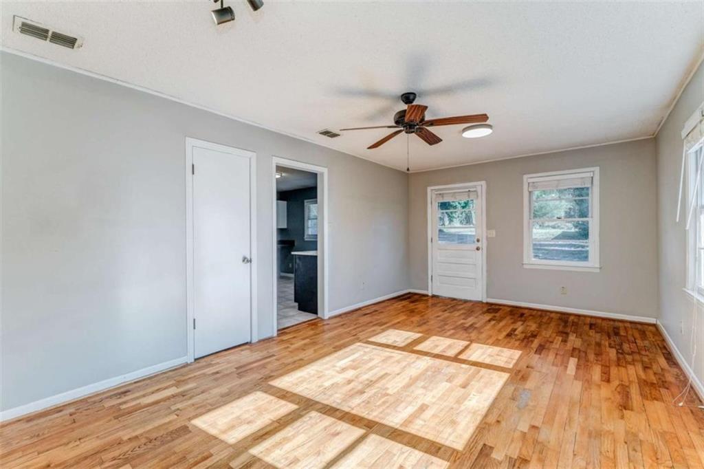 1407 East 2nd Avenue Southeast Rome, GA 30161 - Photo 18 of 28 a bedroom with a bed and a chandelier