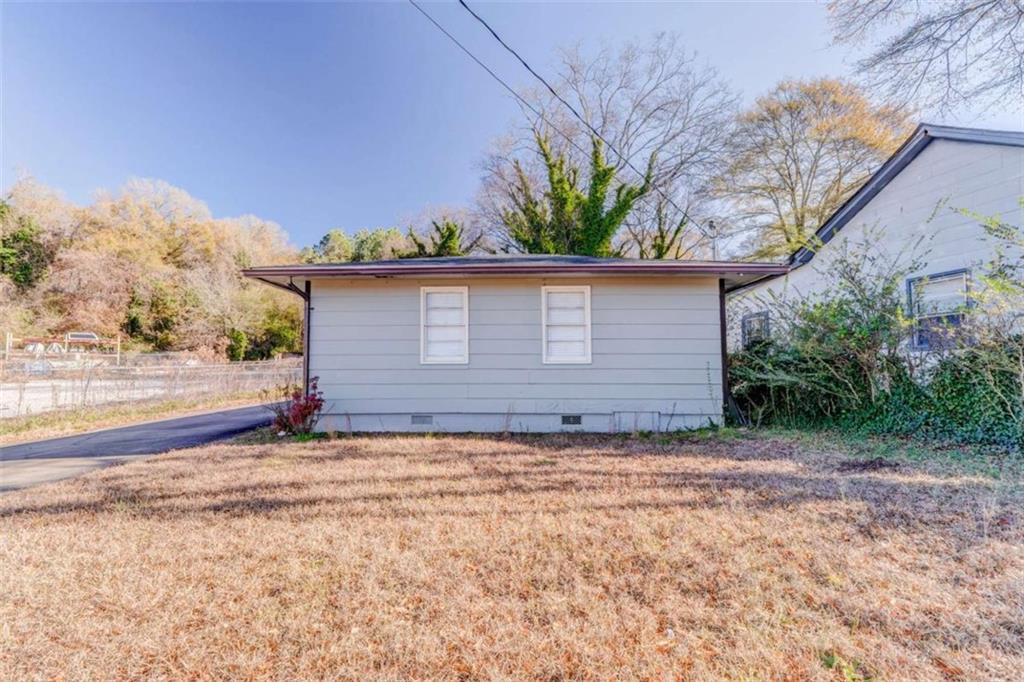 1407 East 2nd Avenue Southeast Rome, GA 30161 - Photo 21 of 28 a view of a house with a yard
