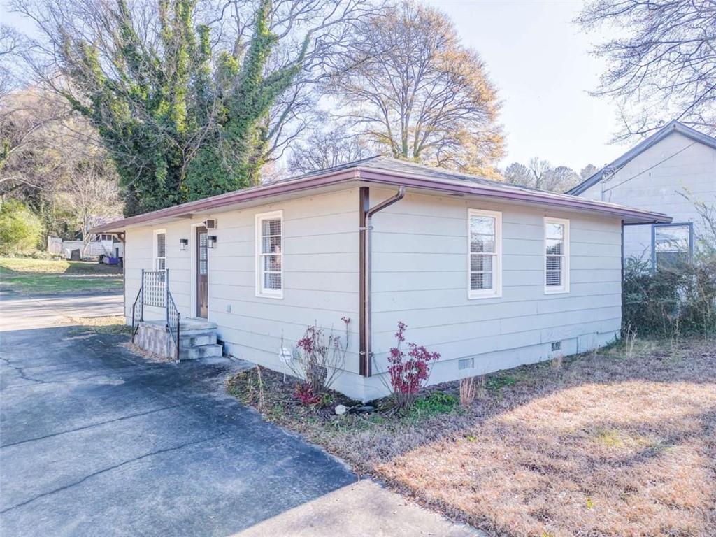 1407 East 2nd Avenue Southeast Rome, GA 30161 - Photo 22 of 28 a view of a small house with yard