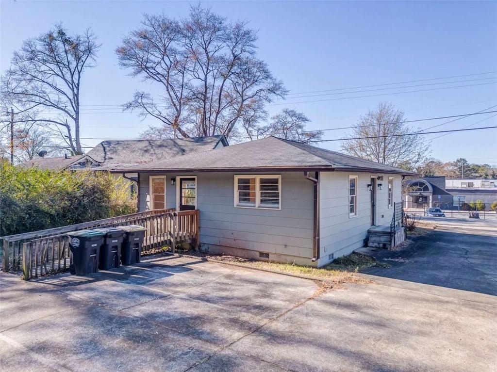 1407 East 2nd Avenue Southeast Rome, GA 30161 - Photo 26 of 28 a view of a house with wooden walls and a yard