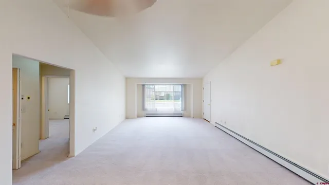 a view of an empty room and window