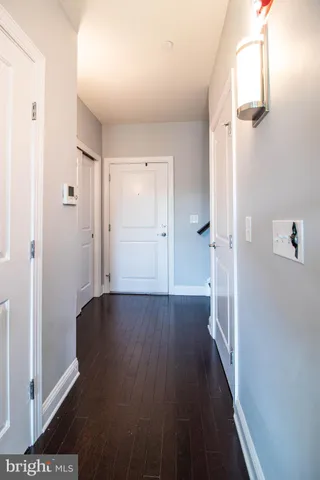 a view of a bathroom with wooden floor