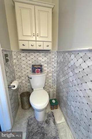 a bathroom with a toilet and a sink