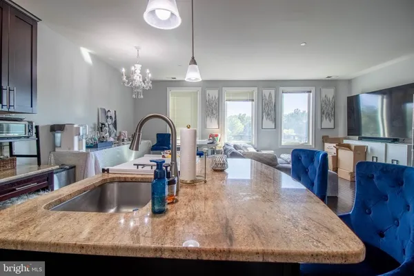 a view of a kitchen and dining room