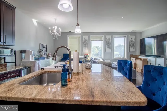 a view of a kitchen and dining room