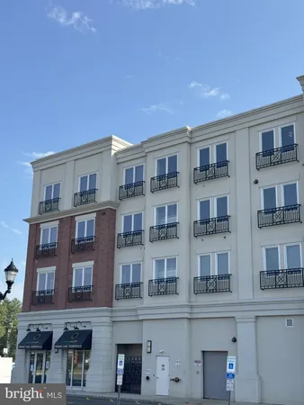 a front view of a building with glass windows