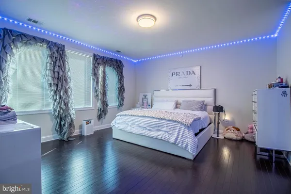 a bedroom with a bed and a table