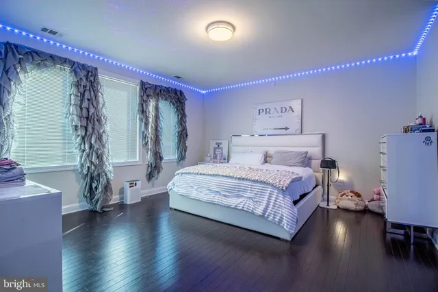 a bedroom with a bed and a table