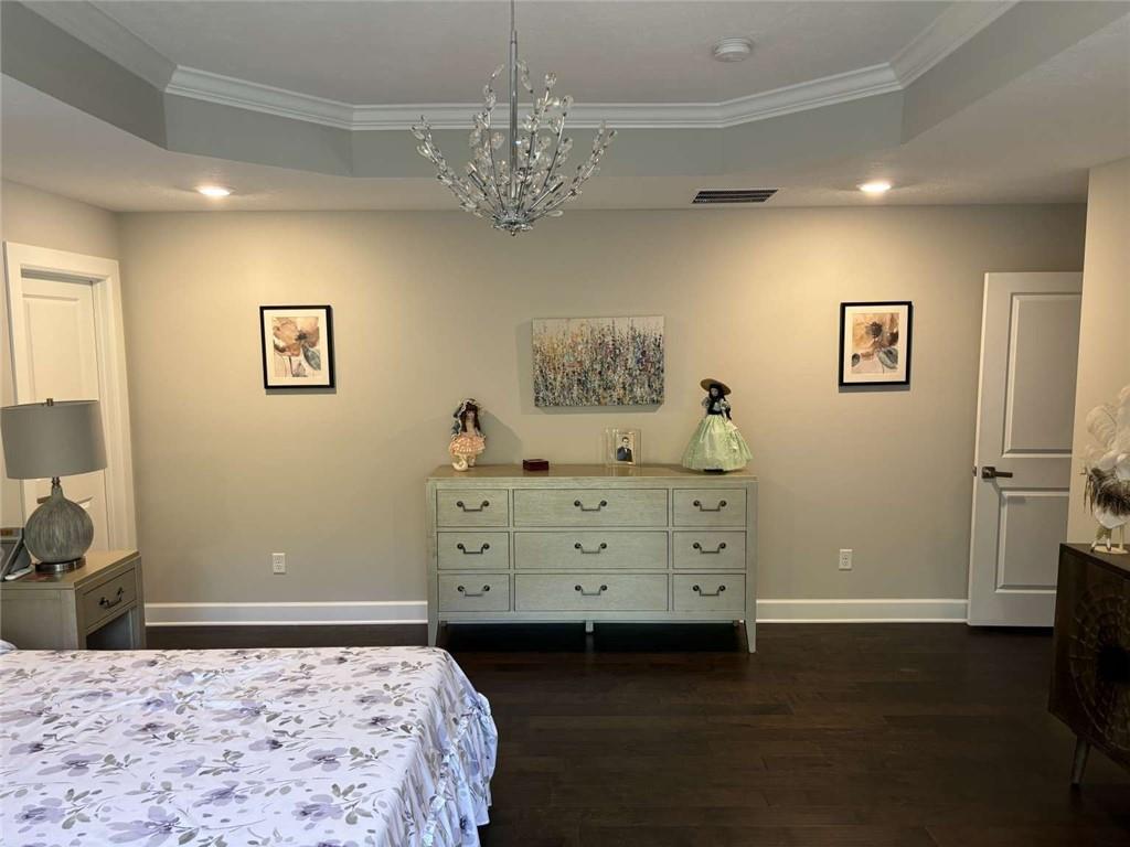 102 Cole Drive McKees Rocks, PA 15136 - Photo 13 of 25 a bedroom with a bed and a chandelier