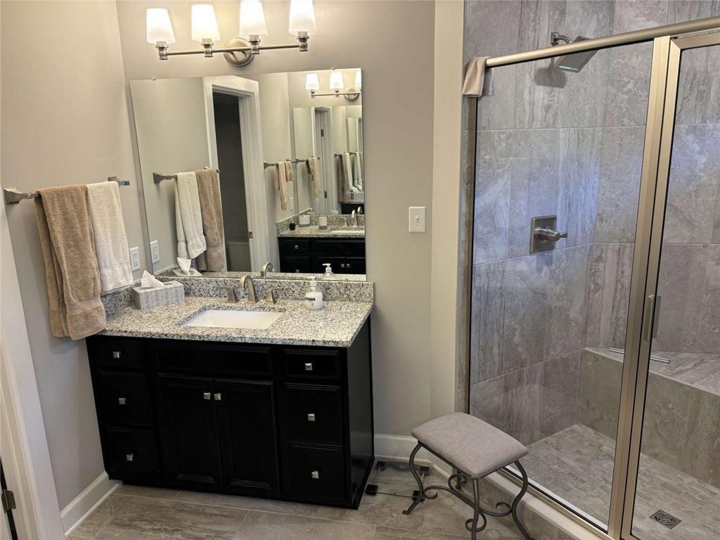 102 Cole Drive McKees Rocks, PA 15136 - Photo 15 of 25 a bathroom with a granite countertop sink shower and a mirror