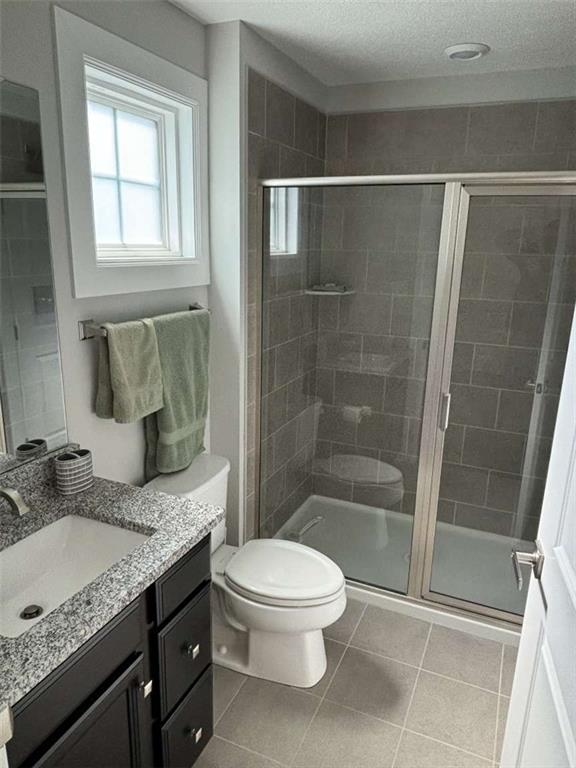 102 Cole Drive McKees Rocks, PA 15136 - Photo 21 of 25 a bathroom with a granite countertop sink a toilet and shower