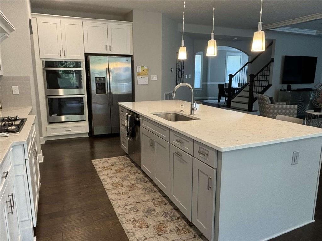 102 Cole Drive McKees Rocks, PA 15136 - Photo 9 of 25 a kitchen with stainless steel appliances granite countertop a sink a stove and a refrigerator