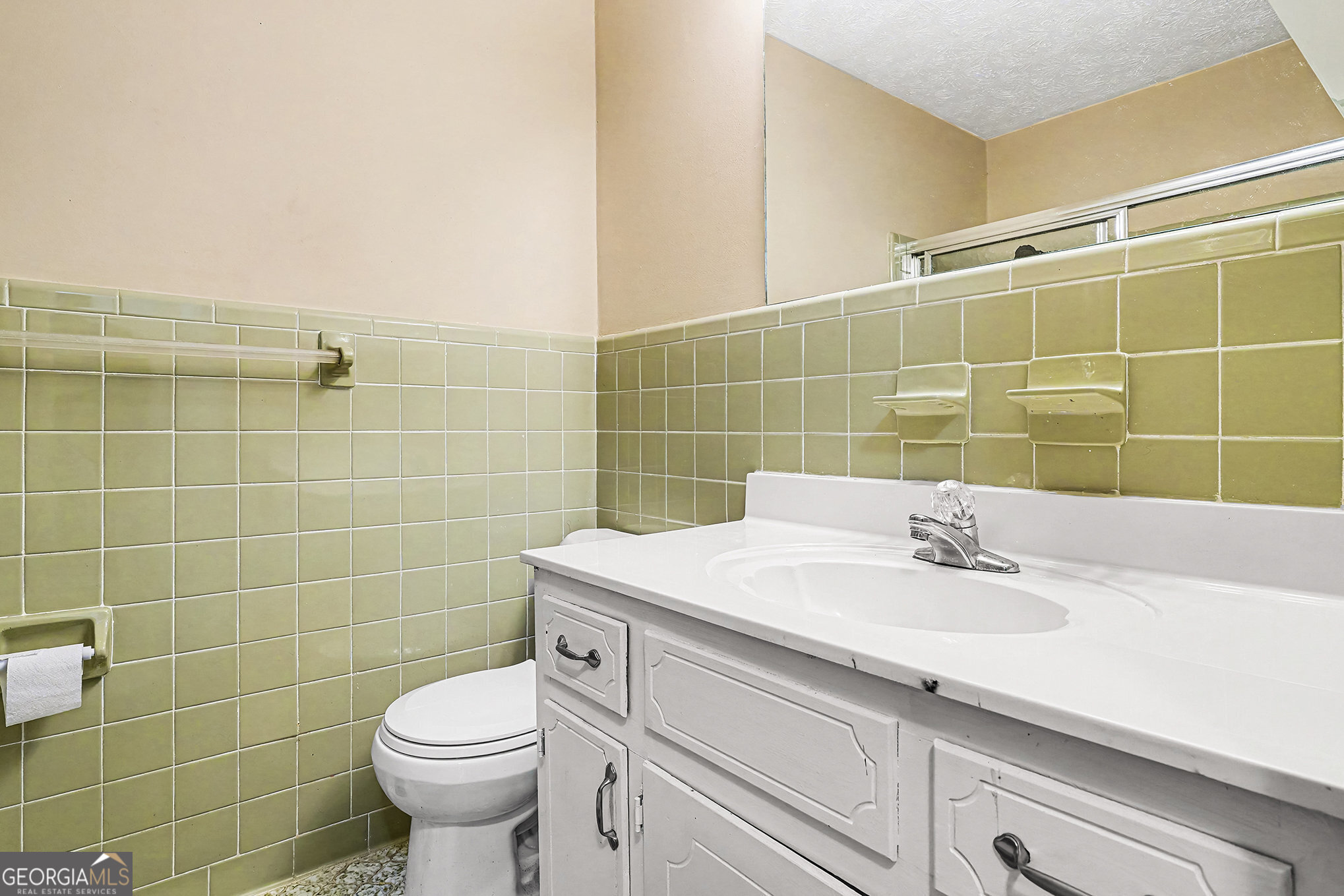 141 Grove Road Locust Grove, GA 30248 - Photo 17 of 27 a bathroom with a sink toilet and shower