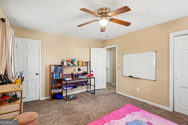 a view of a workspace with furniture