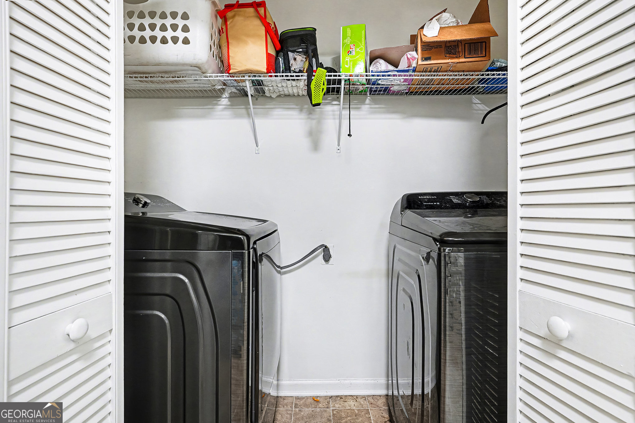 141 Grove Road Locust Grove, GA 30248 - Photo 23 of 27 a utility room with dryer and washer