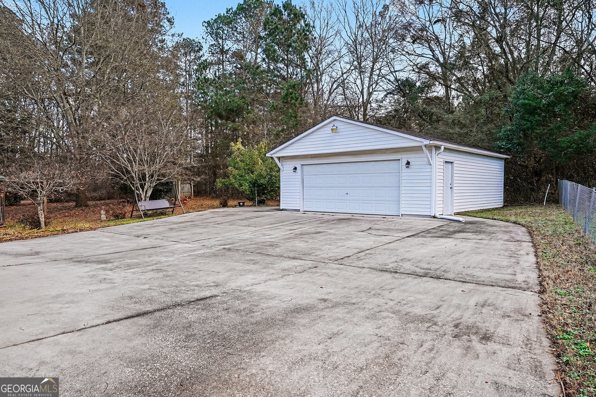 141 Grove Road Locust Grove, GA 30248 - Photo 24 of 27 a front view of a house with a yard and garage