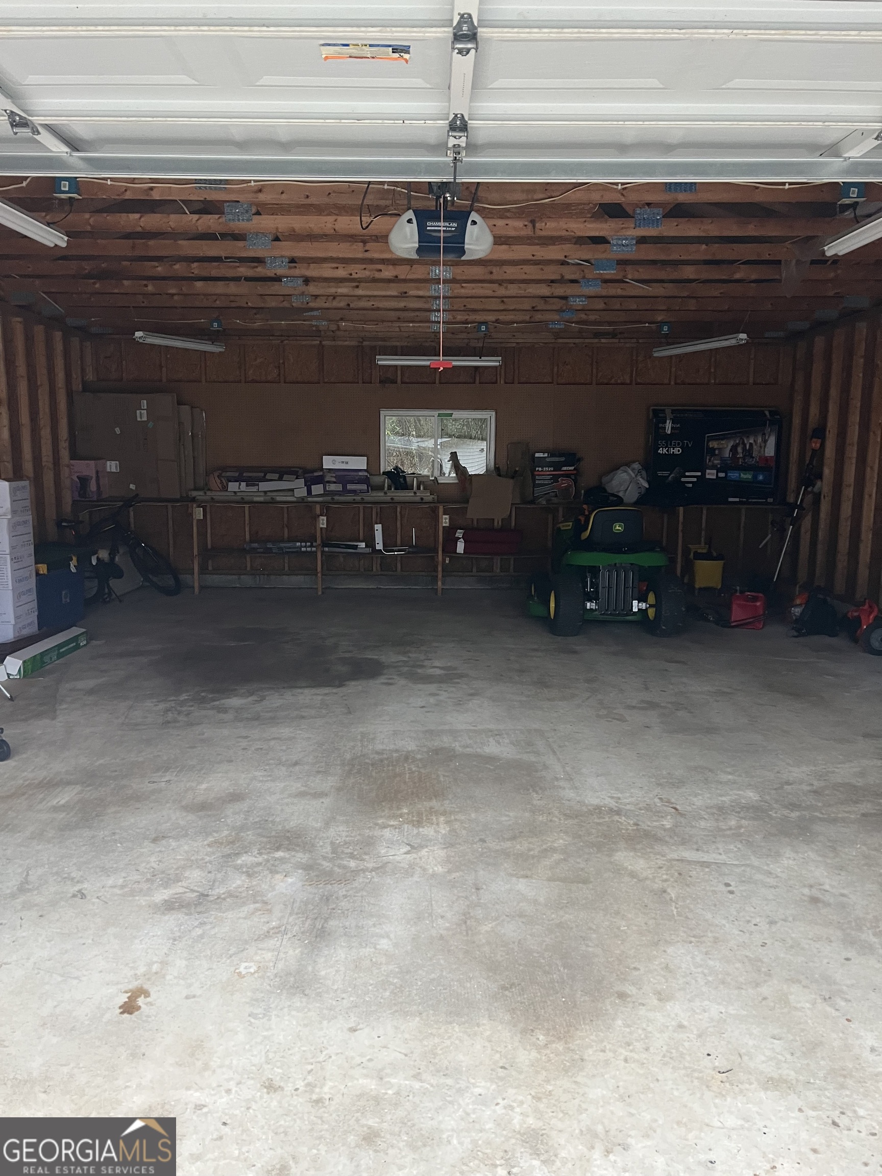 141 Grove Road Locust Grove, GA 30248 - Photo 25 of 27 a view of a garage with stuff