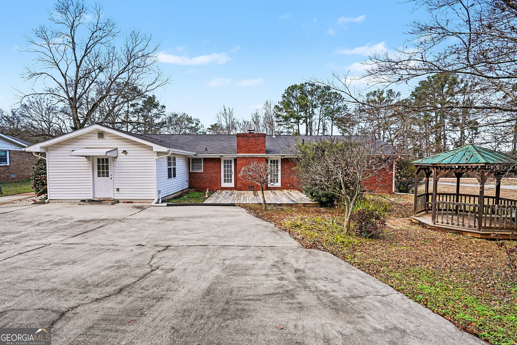 141 Grove Road Locust Grove, GA 30248 - Photo 26 of 27 a front view of a house with a yard and garage