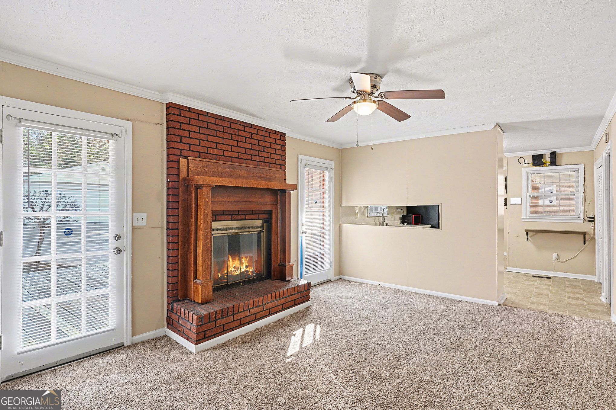 141 Grove Road Locust Grove, GA 30248 - Photo 5 of 27 a view of a livingroom with a fireplace and window