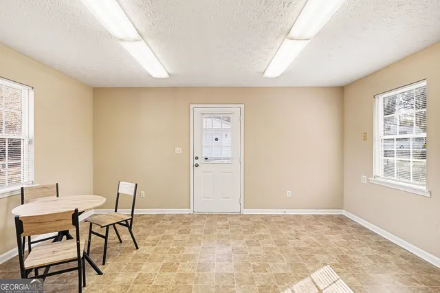 a workspace with furniture and window