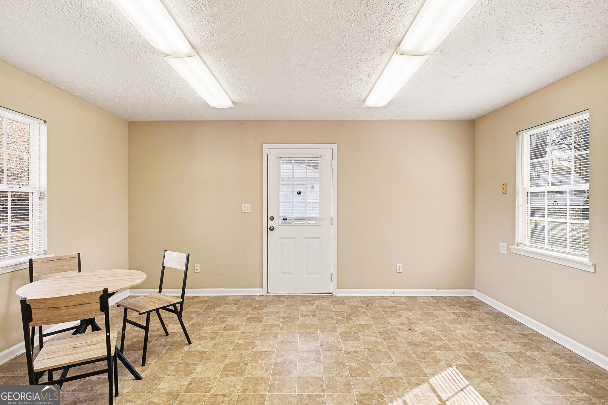 141 Grove Road Locust Grove, GA 30248 - Photo 6 of 27 a workspace with furniture and window