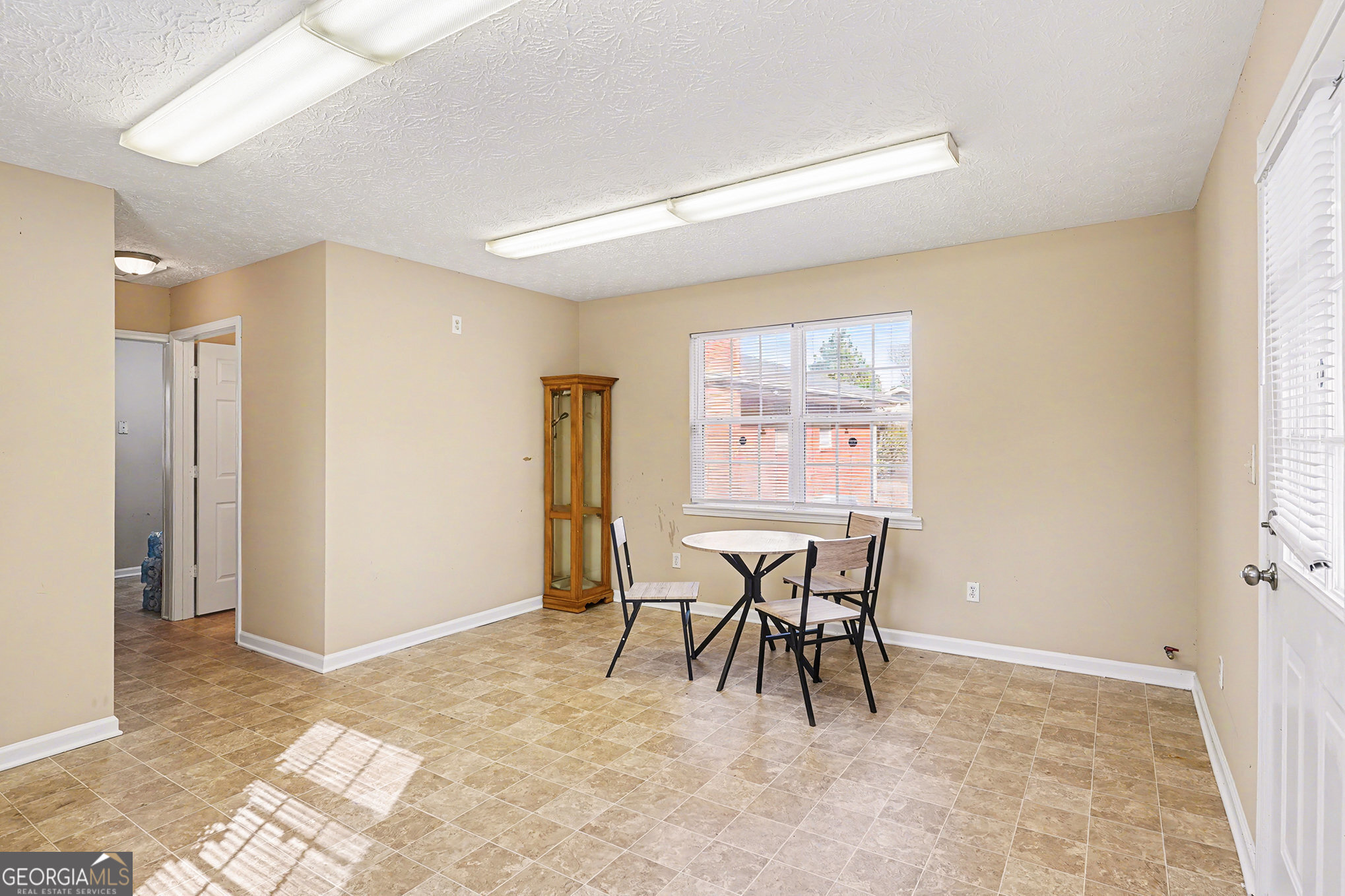 141 Grove Road Locust Grove, GA 30248 - Photo 7 of 27 a view of a livingroom with furniture and a window