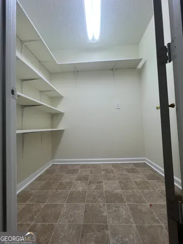 a view of an empty walk in closet