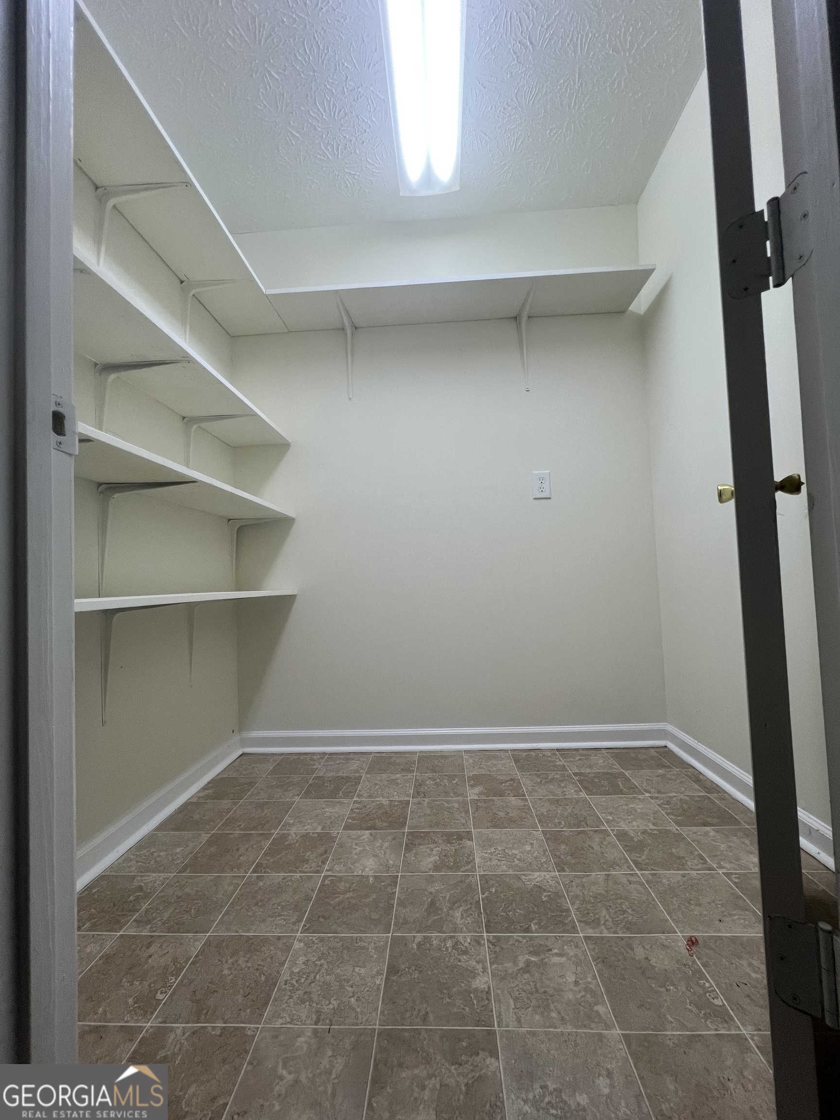 141 Grove Road Locust Grove, GA 30248 - Photo 10 of 27 a view of an empty walk in closet