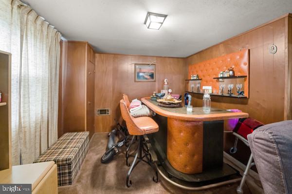 3413 Retlaw Road Baltimore, MD 21207 - Photo 20 of 32 Retro bar area with warm wood tones.