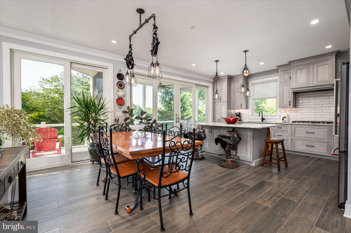 583 Riverside Drive Pasadena, MD 21122 - Photo 9 of 54 Dining Area flows seamlessly into gourmet kitchen