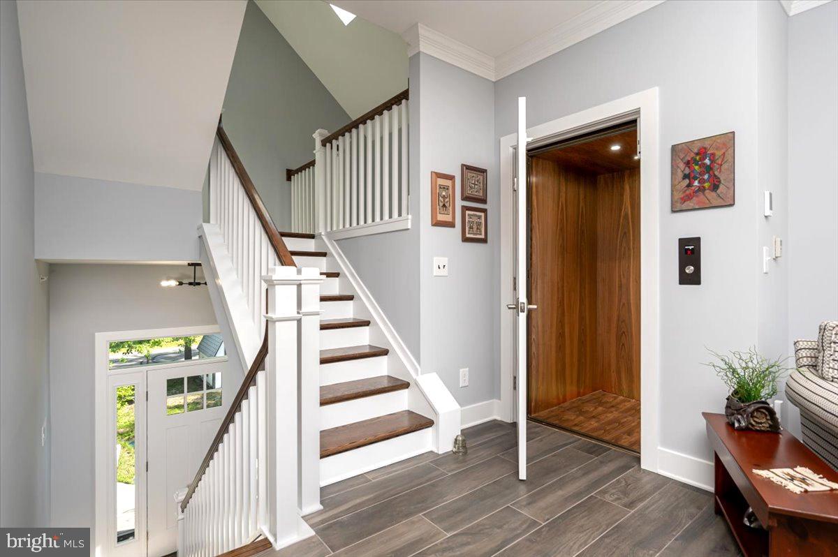 583 Riverside Drive Pasadena, MD 21122 - Photo 22 of 54 Elevator closet and stairway to 2nd level