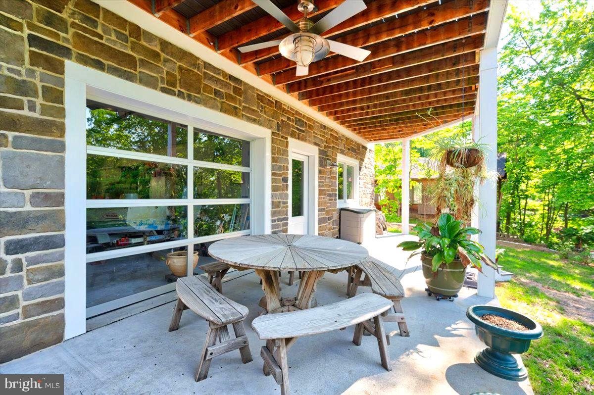 583 Riverside Drive Pasadena, MD 21122 - Photo 35 of 54 Roll up door open to patio from garage