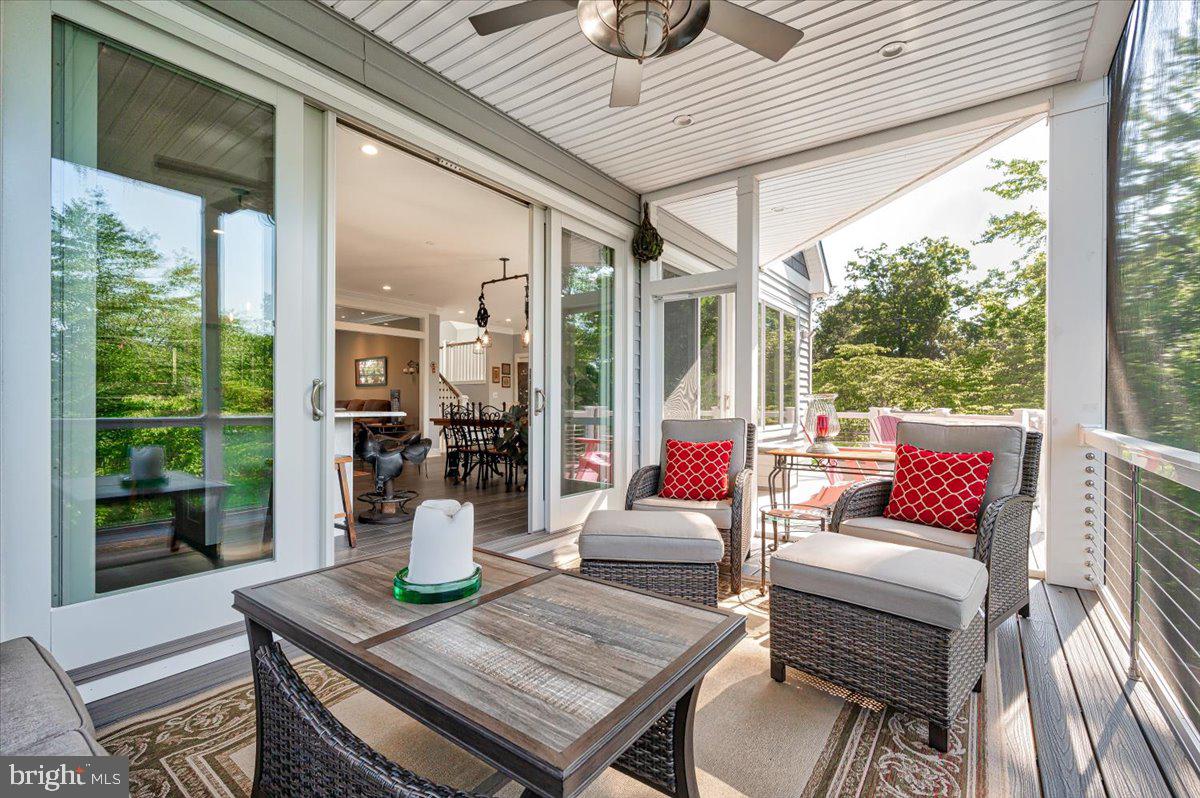 583 Riverside Drive Pasadena, MD 21122 - Photo 3 of 54 Scenic screened porch off living area