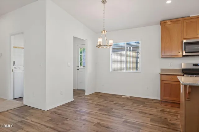 a view of a kitchen from the hallway
