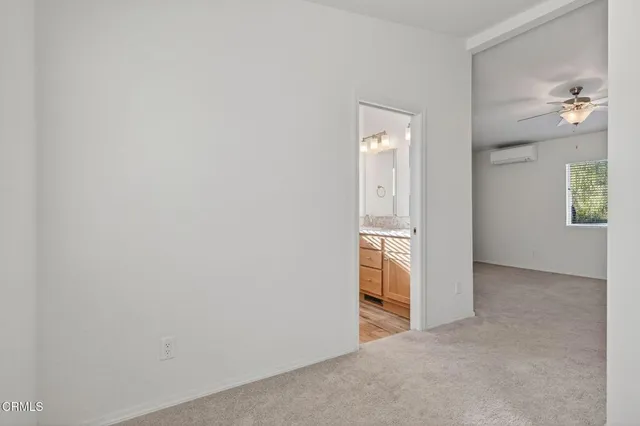 a view of an empty room and window