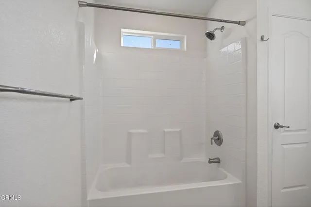 a close up of a bathtub curtain