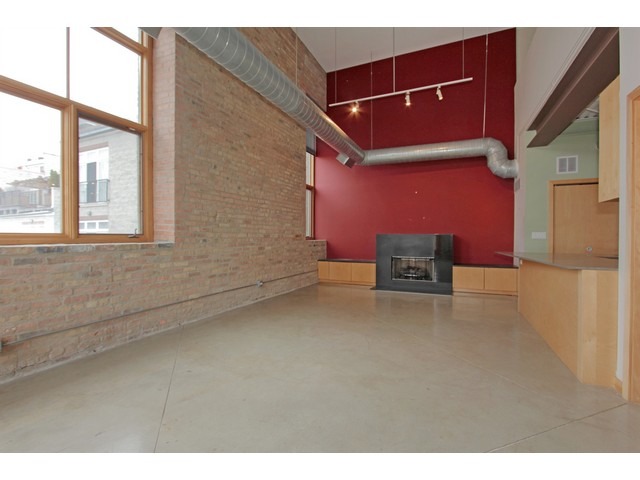 2101 West Rice Street, Unit 301 Chicago, IL 60622 - Photo 3 of 13 a view of an empty room with a window