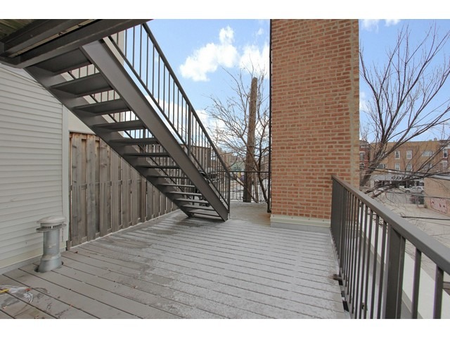 2101 West Rice Street, Unit 301 Chicago, IL 60622 - Photo 10 of 13 a view of an entryway with wooden floor