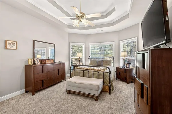 a bedroom with a bed and a couch