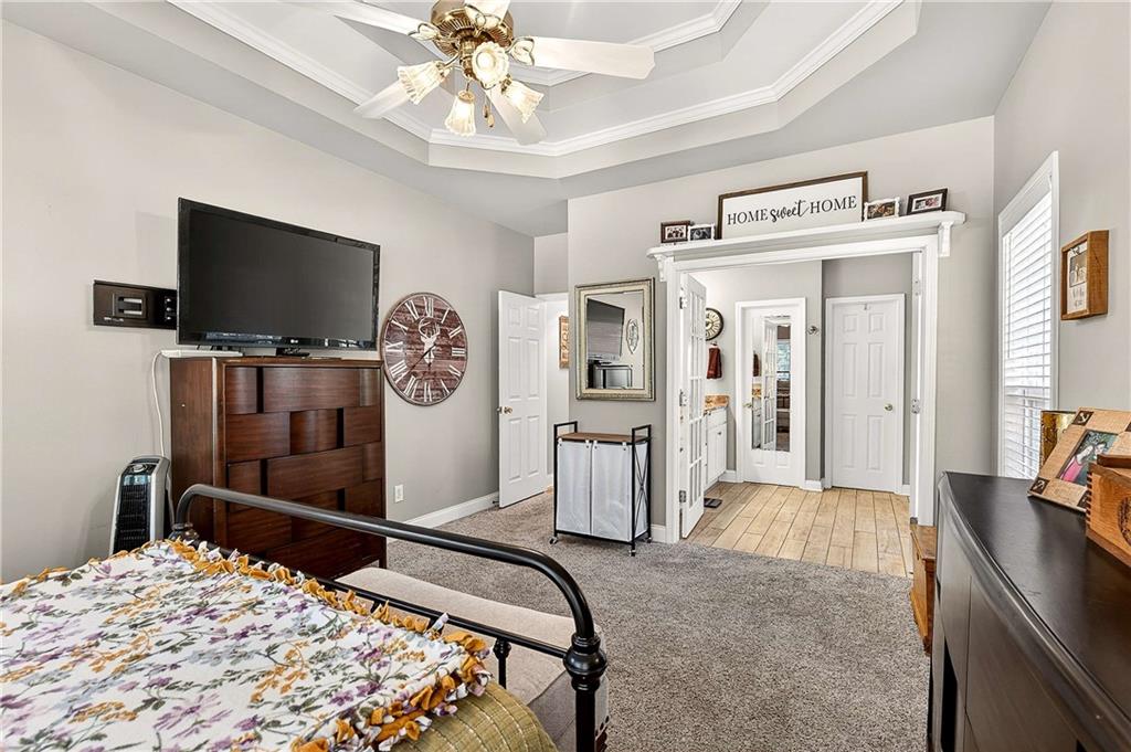 58 Legend Drive Villa Rica, GA 30180 - Photo 14 of 27 a bedroom with a bed and a flat screen tv