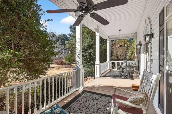 a view of balcony with wooden floor
